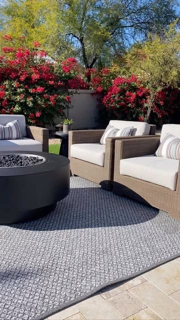 Wicker swivel lounge set around a fire pit