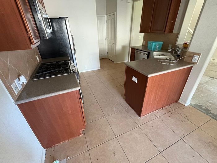 Before: kitchen with cherry cabinets